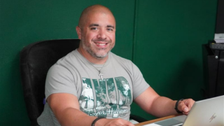  Carlos Sotos at desk